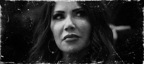 Black & white image of Kristi Noem looking to the side with rough overlay